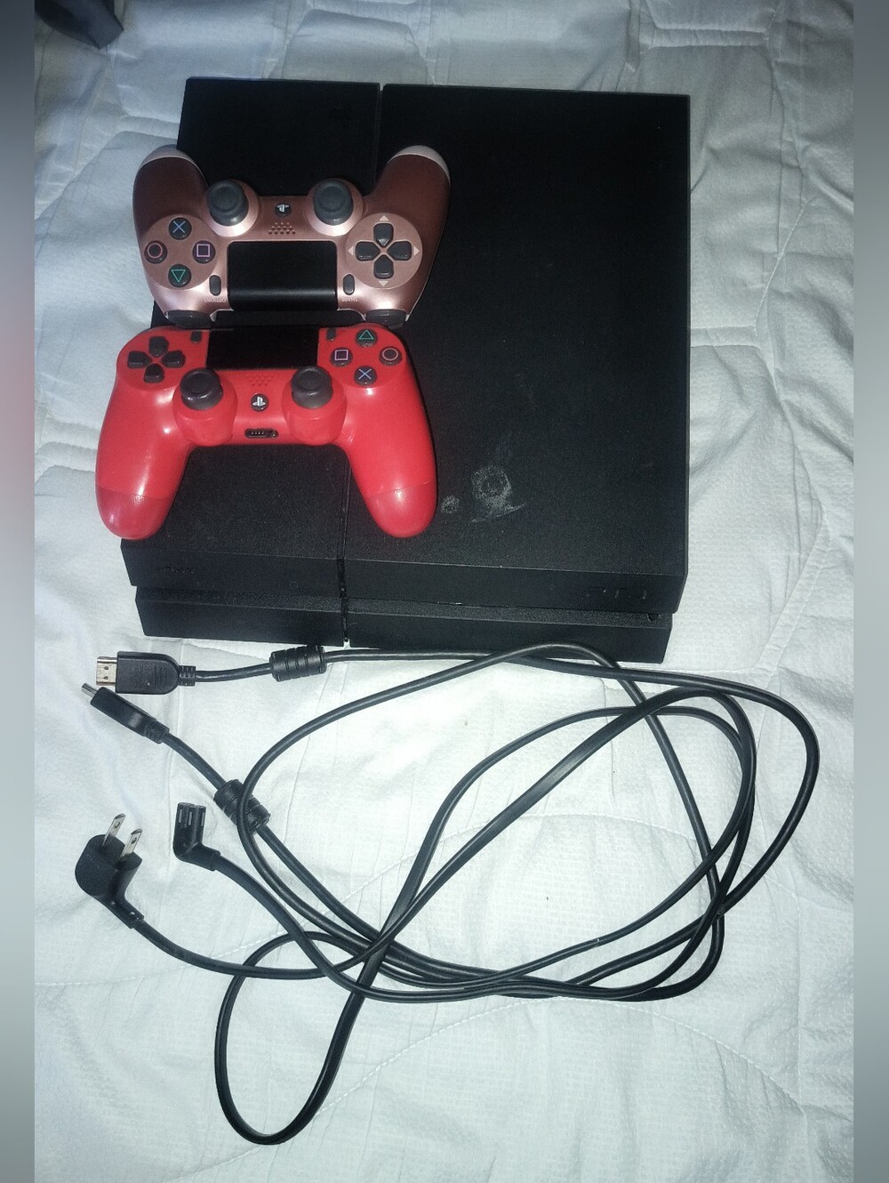 Sony PlayStation 4 (500GB) with 2 Red and Rose Gold DualShock Controllers.
